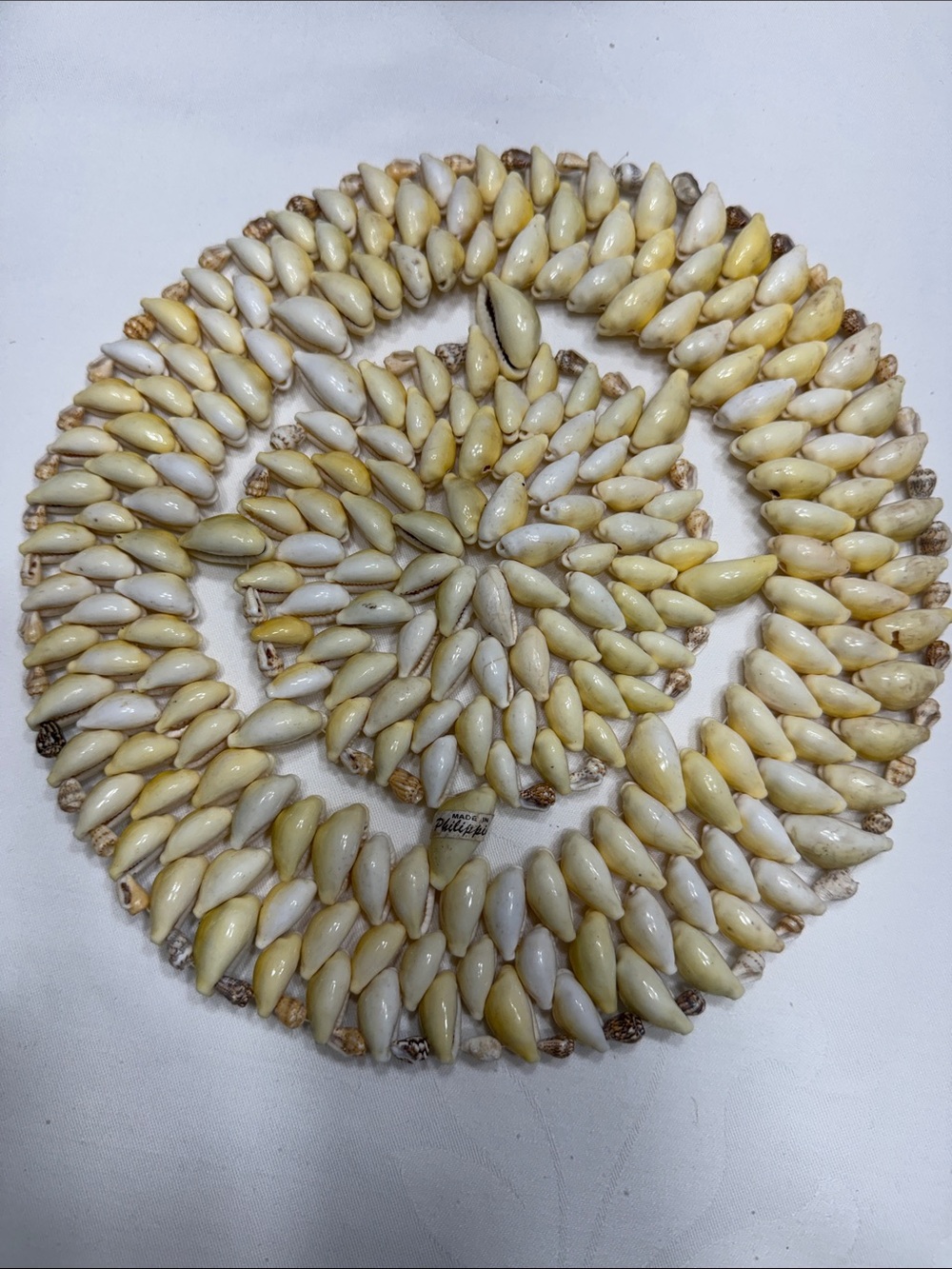 Vtg. 1970’s Cowrie sea shell 9 1/4” trivet.
